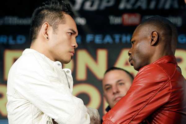 Nonito Donaire (left) and Guillermo Rigondeaux size each other up ahead of their April 13 fight. (AP)